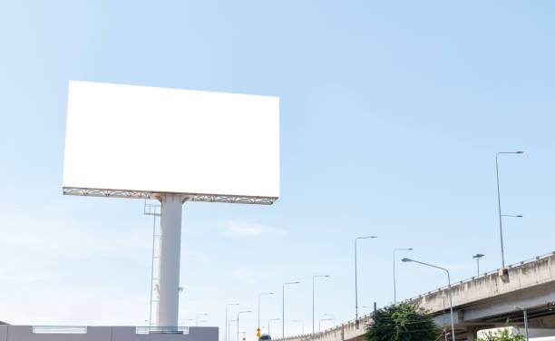 istock Pole outdoor billboard with blue sky background. Clipping path for mockup white screen 1886456564