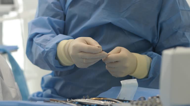 Doctor's hands with a working tool. Preparation and process of dental treatment.