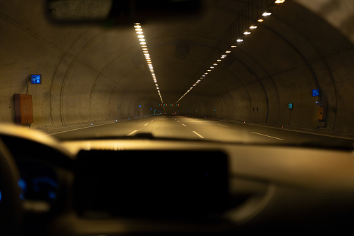 Driving Through A Dark Tunnel On Highway