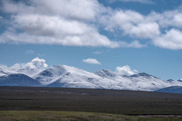 istock Snowy mountains and landforms on the plateau 1886633760