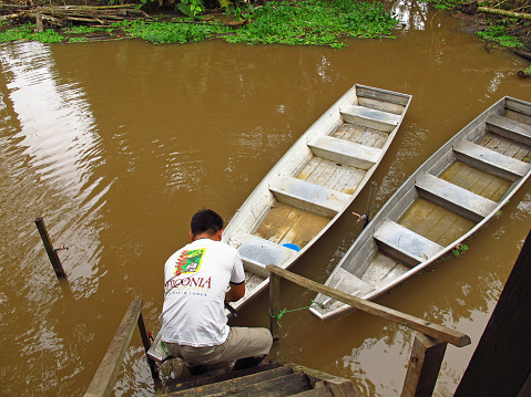 Amazon river, Peru - 10 May 2011: People in the boat in Amazon river in Peru, South America