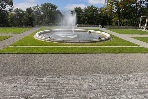 Kamieniec Zabkowicki, Poland - October 2, 2021: Kamieniec Zabkowicki Palace, 19th-century monumental palace located in a village in the Lower Silesian Voivodeship. Fountain in front of the main entrance