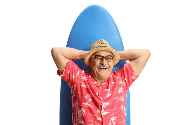 istock Smiling mature man lying on a surfing board 1886653559
