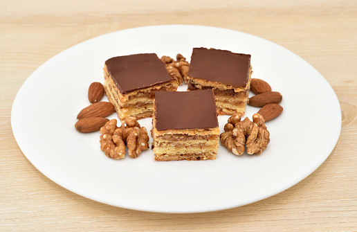 Chocolate snack bar with nuts and caramel closeup