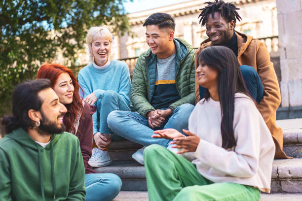 istock Joyful Friends Sharing Laughter on City Steps 1886667154