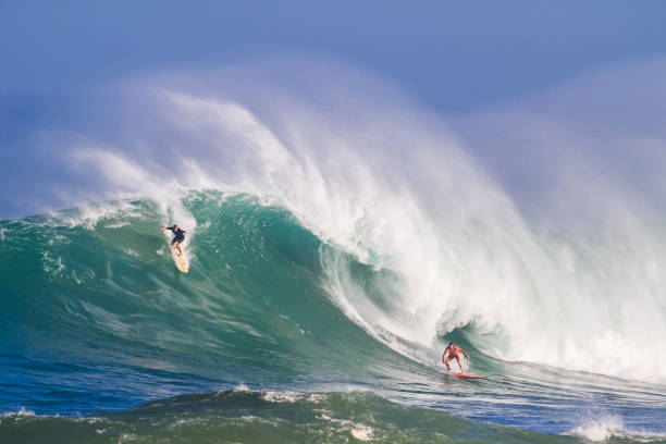 Surfer on a wave from under water
