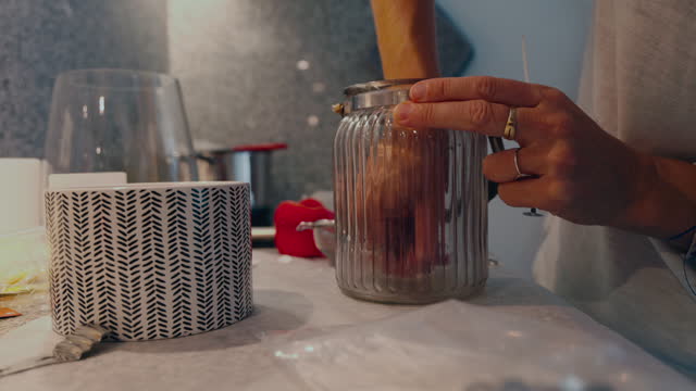 Making candles at home with used wax, zero waste concept, sustainable small business