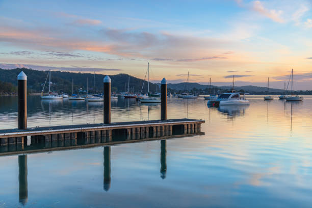 istock Sunrise, boats and reflections on the water 1886705162