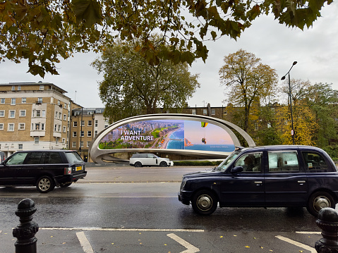 London, United Kingdom – November 14, 2023: A twisted steel advertising board at London, Kensington by Zaha Hadid