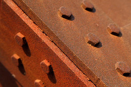 oxidized rusty steel plate and rivet