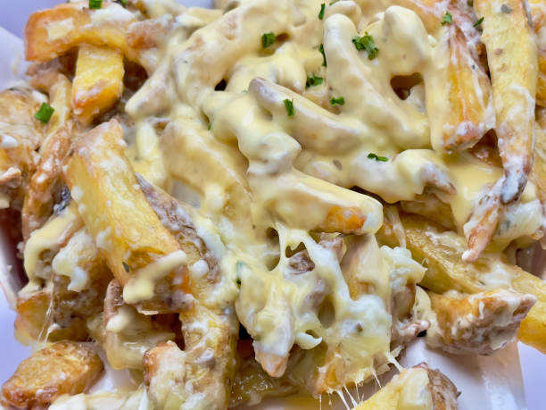 istock Wicker basket filled with cooked potatoes covered with melted cheese 1886746319