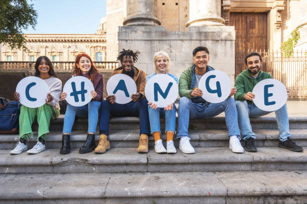 Diverse Students Holding 'CHANGE' Signs in Campaign