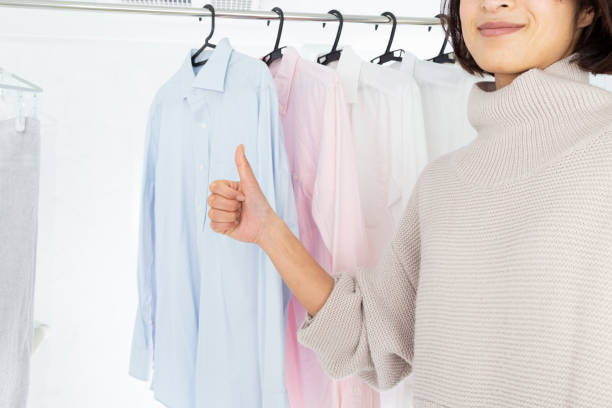 istock A woman hangs laundry in the bathroom. 1886768227