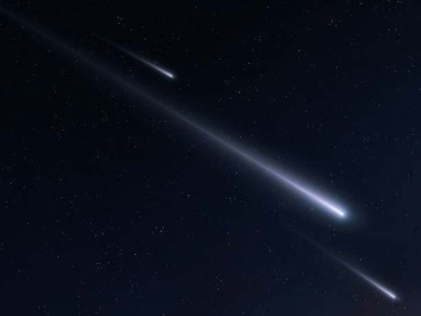 istock Fireballs on a starry background. Meteors in the sky at night. 1886769777