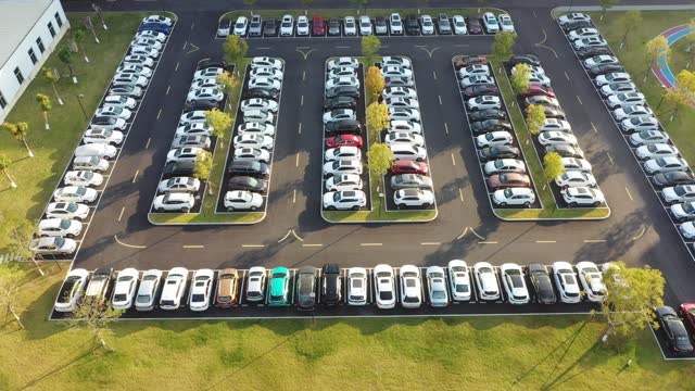 The parking lot is neatly filled with cars