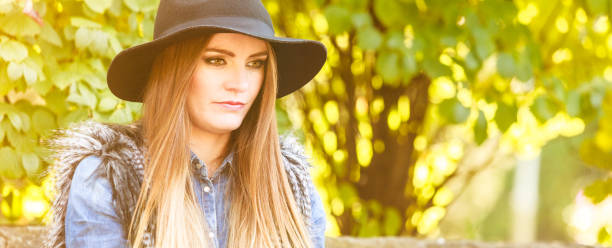 istock Pretty girl in park 1886846203