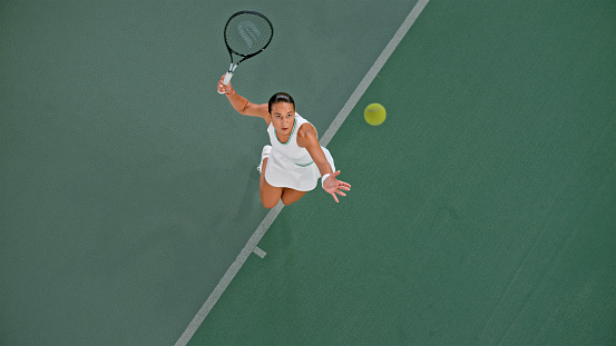 Tennis player playing in tennis court