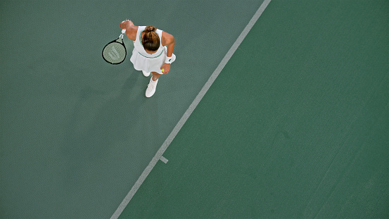 Aerial view of a tennis match on clay court.