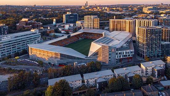 London, United Kingdom – August 07, 2022: An aerial view of Gtech Community Stadium at sunset. London, UK