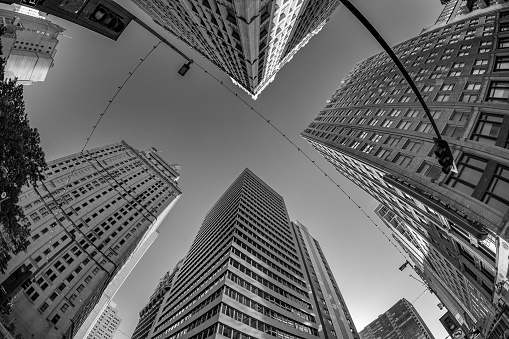 Dallas, USA - November 6, 2023: fisheye view of historic skyscraper in old town od Dallas under blue sky.