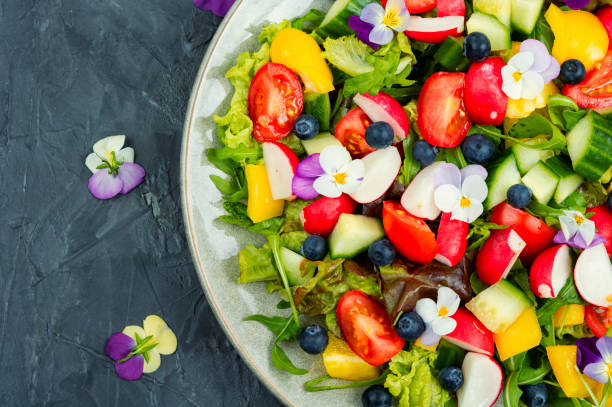 istock Spring salad with edible flowers. 1886877061
