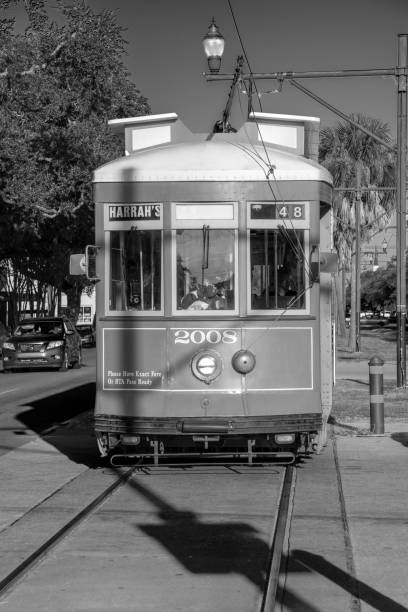 people in new orleans use the street car in early morning to go to town and work. - new orleans cable car louisiana street ストックフォトと画像