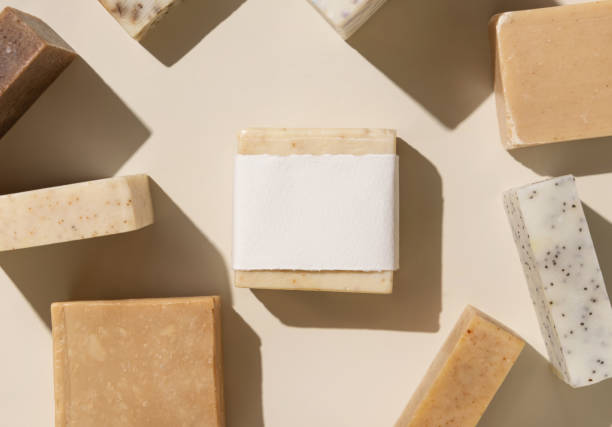 istock Beige and brown soap bars on light beige close up, hard shadows, packaging mockup 1886883337