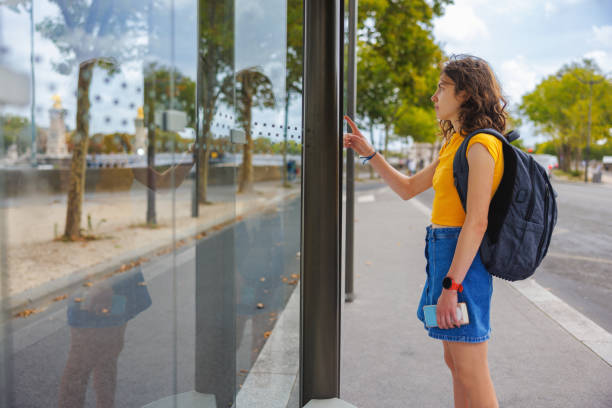 istock Studying the city map at the bus stop, waiting for public transportation 1886890144