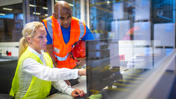 istock Shipping operator showing orders list to worker 1886894299