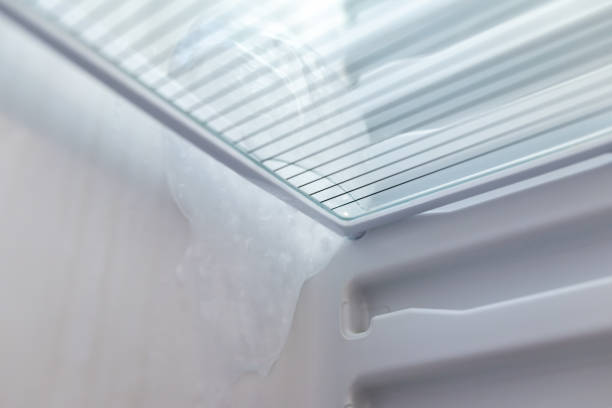 istock Close up of fridge with ice on its inner side 1886895353