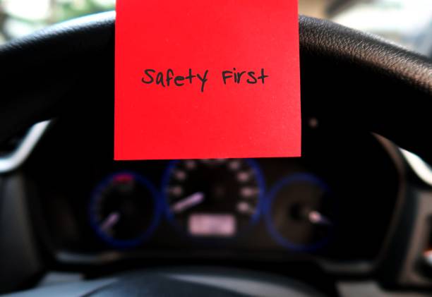 istock Car console panel with handwritten stick note SAFETY FIRST , concept of car driver self reminder to to drive carefully with mindset of safety first, be alert to reduce accidents on the road 1886971904