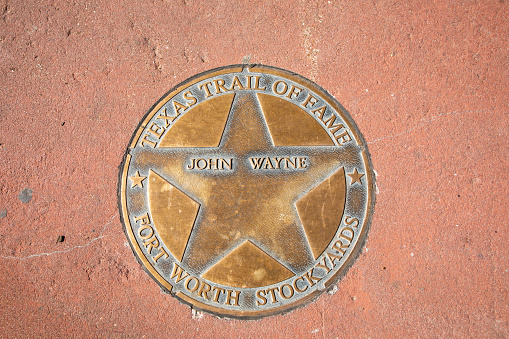 Fort Worth, Texas - November 5, 2023: texas trail of fame honors John Wayne with a plate at walk of fame in Fort Worth