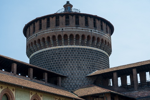 Milan, Italy – June 19, 2023: The tower of Sforzesco Castle against the background of the sky
