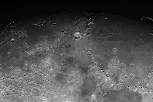 Astronomical photograph of the moon. Photo of the moon with high magnification. Moon surface with craters.