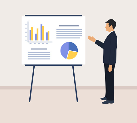 Businessman Presenting A Report At A Flipchart. Business Presentation Concept