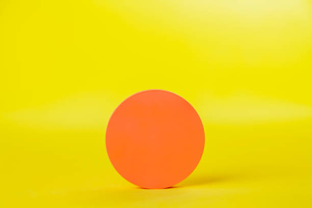 istock Pot of cream on yellow background 1887026472