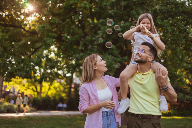 istock Family Blow Soap Bubbles 1887032727