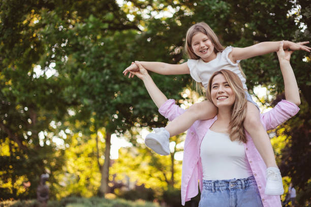 istock Mother Having Fun With Her Daughter Outdoor 1887036389