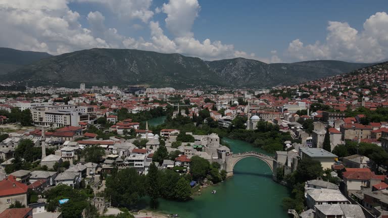 The image of the city's stone houses and the harmony of the historical Mostar bridge with the urban texture