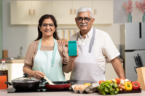 Senior couple making meal