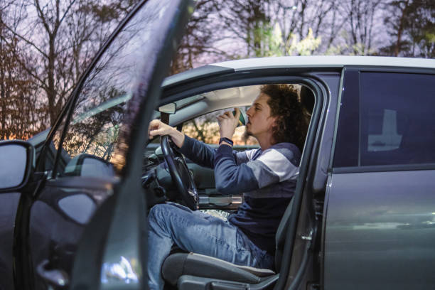Young man working early in the morning so he stopped at a pit stop to grab a coffee before driving to work