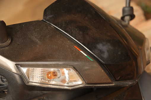 Front Part LED lamp of a Scooter or bike head lamp in black and grey color, indicator light