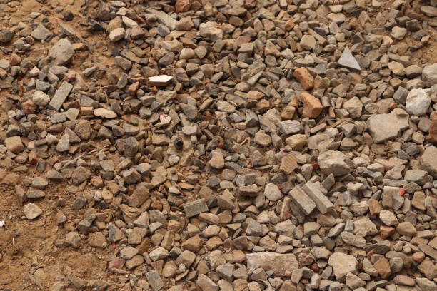 istock Small broken stones, bricks and gravel with broken tiles on the ground, dirt 1887095066