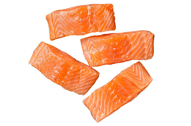 istock Fresh Raw salmon fish fillet steaks Isolated on white background, top view. 1887102180