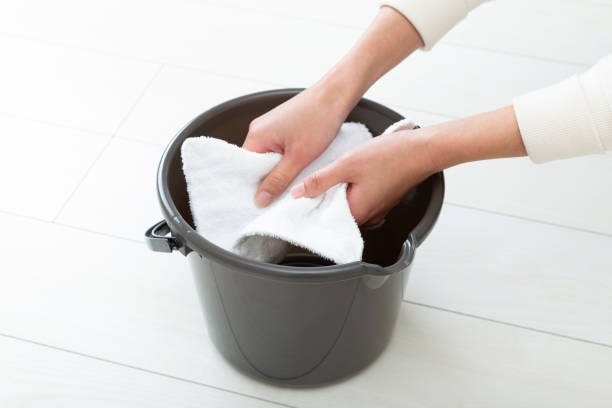istock Woman's hands cleaning the floor. 1887174694