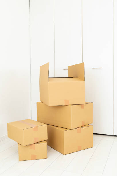 istock Cardboard boxes piled up in the room. 1887175230