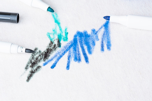 Dirty marker stains or felt-tip pens on the sofa or a carpet. Top view
