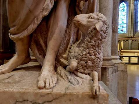 Lyon Cathedral is a Roman Catholic church located on Place Saint-Jean in central Lyon. Begun in 1180 on the ruins of a 6th-century church, it was completed in 1476. The image shows a close up of a marble statue inside the gothic church.