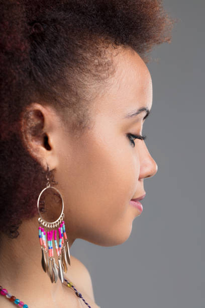 istock Contemplative gaze, unique, colorful earrings 1887206229