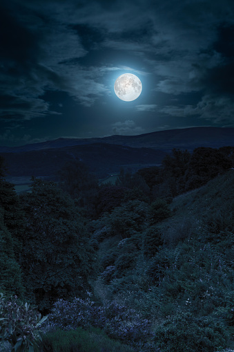 Digital composite  moonscape over a valley in the Yorkshire Dales National Park, England.